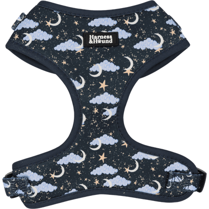 Dog harness with celestial pattern featuring clouds, stars, and moons on a dark background.