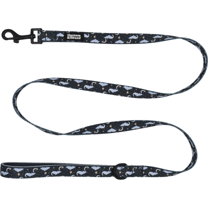 Dog leash with moon and star pattern on a black background