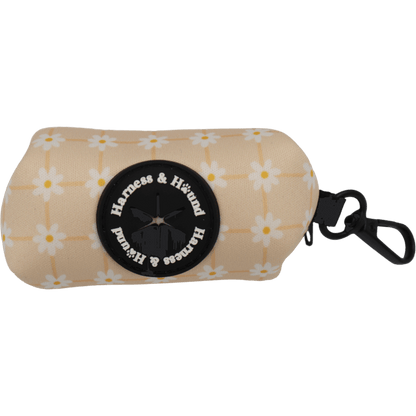 Beige pouch with floral pattern and 'Harness & Hound' logo on a black background