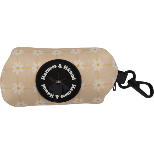 Beige pouch with floral pattern and 'Harness & Hound' logo on a black background